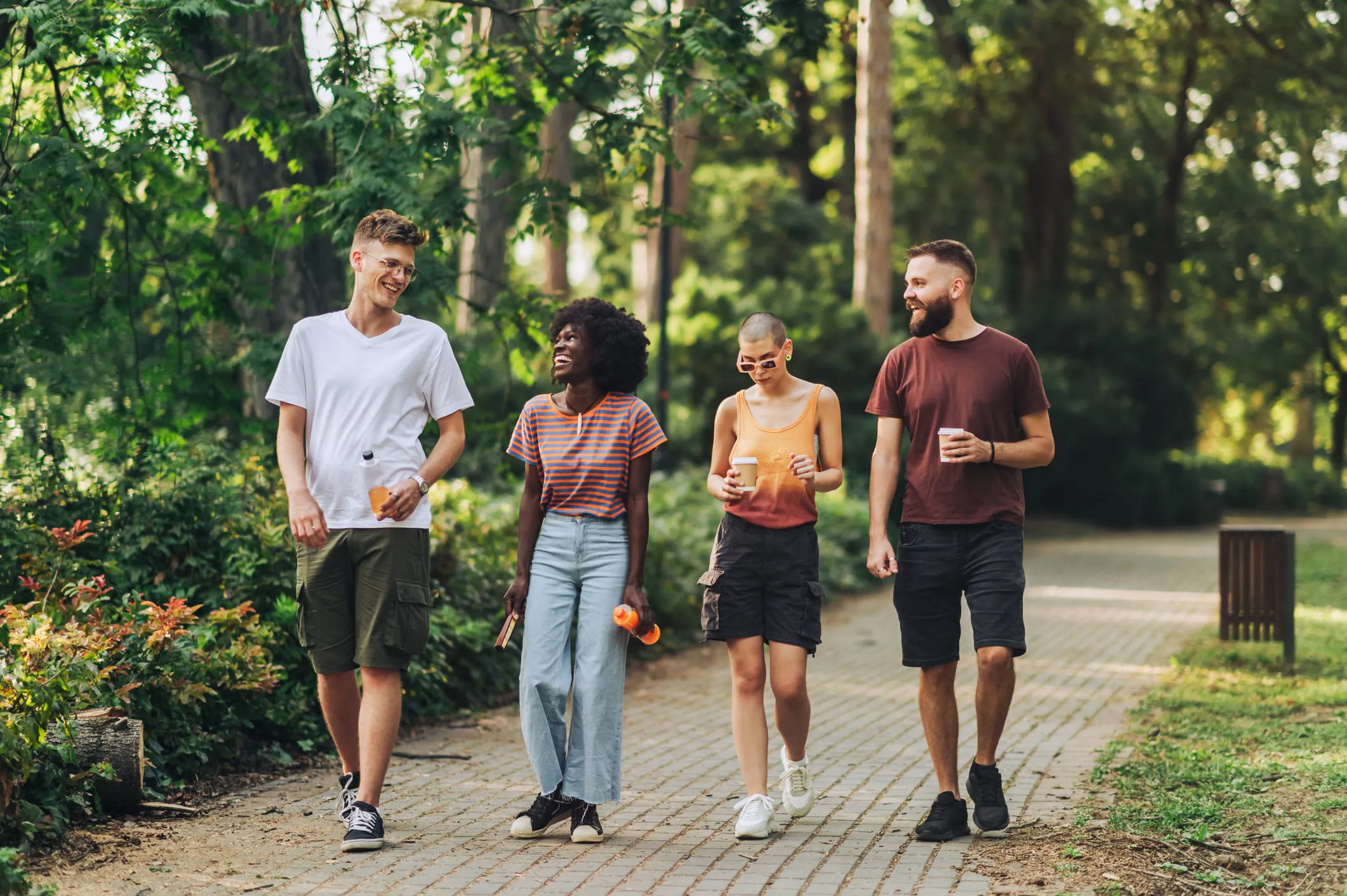 Neighbors walking together on a hillside trail